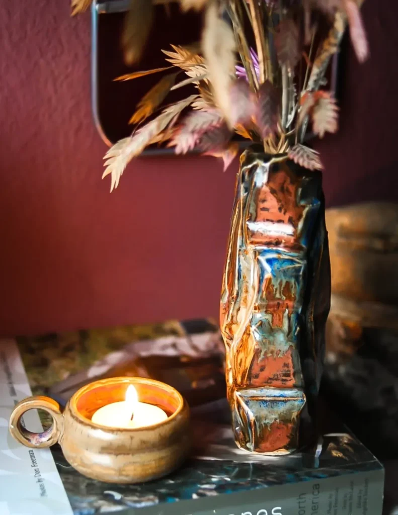 Handcrafted ceramic vessel with intricate textures, representing the "ghost cities" of the mind and the transition from thought to direct experience.